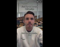 Guy white sweater raising hand answering basic math questions wrong