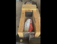 Wood machine used to crush beer cans 