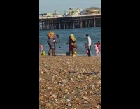 Girl yellow bikini shoes beach sand kid