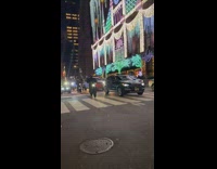 Guys ride motorcycles and ATVs down street 