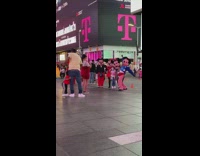 Kids pose with minnie mickey mouse mascots