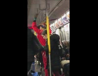 man in red outfit hat feather