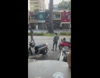 Leopard print jacket girl sidewalk silver scooter