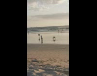 Guy try to do handstand beach sunset