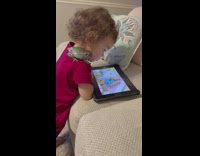 Kid Watches Kids Show with Pet Frog