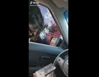 Broken drive thru ordering screen with holes and broken glass