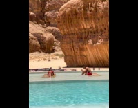 Woman red bikini on sunbed for photo