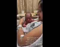 Newborn pandemic baby pushes itself up from moms chest 