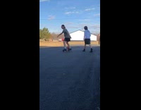 Backwards Hat Short Shorts Kid Rides Ripstick Driveway