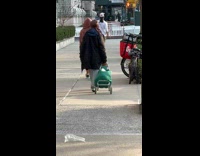 Collab WINY - Long Haired Man Jogs Barefoot on Sidewalk