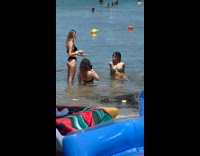 Lady Instructs Friend How to Pose on Beach Part 1