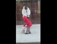 Dad rainbow stick fence kid red jacket 