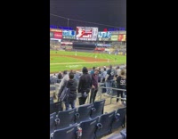 Man with Fedora Poses at Baseball Stadium