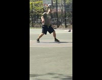 Guy at park doing tricks with football