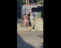 Guy blindfold underwear hold hands walk street