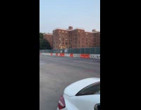 Collab WINY - Orange car drives with man on hood