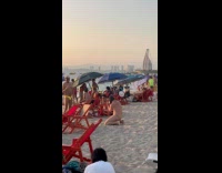 Man dog mask tiktok dance at beach
