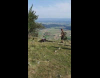 Guy black brown shirt kendama tricks mountain