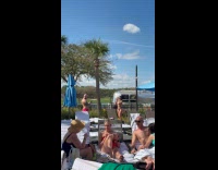 Woman bikini and visor poses at resort yard Part 1