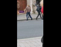 Man brown turban jacket dance video sidewalk