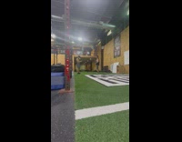 Guy juggles workout equipment 