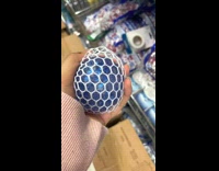 Woman squeeze stress ball overflow over the net