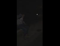 Two Friends Play Fighting at Night One Gets Pushed Into Bush