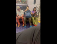 Man peeling cucumber for face mask on subway