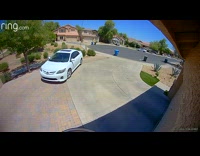 Bad driver leaving driveway hits trash cans