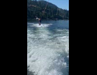 Yellow life jacket guy wakeboard fail lake 