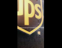 Girl on UPS delivery truck driving smiley face drawing