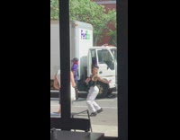 Guy vogue dances outside restaurant 