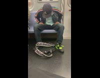 Guy sits leans forward train black jacket