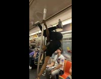 Guy walks upside down with pole 