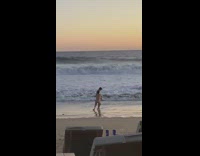 Man brief stand beach seaside sunset pictorial