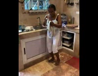 Mother wipe glass cover dance to music