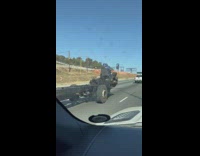 Guy driving in barebones big rig truck