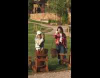 Two women pictorial wooden chairs cabin house