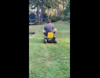 Man rides toy lawn mower falls back