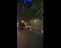 Guy throws trash bags into truck 