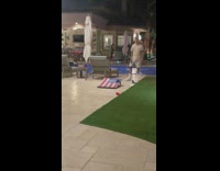 Girl cornhole falls over hole 