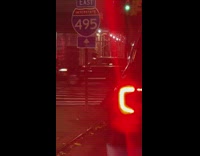 Santa does pull ups on sidewalk 