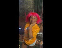 Man and Kid in Wigs Lip Syncs Song