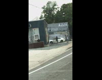 Man camouflage dance outside  tattoo shop