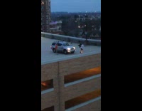 Group guys dance on rooftop car night