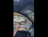 Guy does wheelie on bicycle without front wheel pt. 2