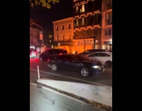 Pile of trash burn on street night