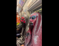 Collab Subway Creatures - Two guys riding subway in alien costume