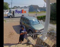 FedEx Deliveryman Tosses Box Package on Porch