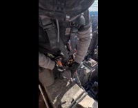 Guy films setting up harness at rooftop